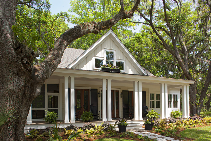 Ranch-style farmhouse with covered porch and rocking chairs