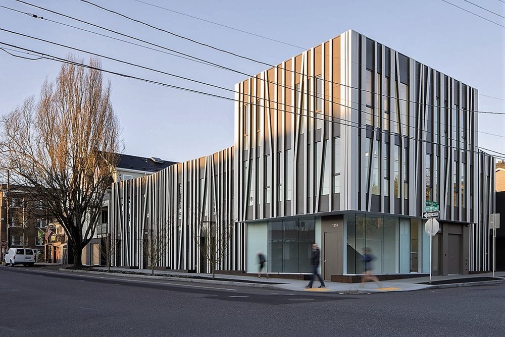 Contemporary Home Design featuring a mix of materials such as wood siding, stone accents, and metal roofing